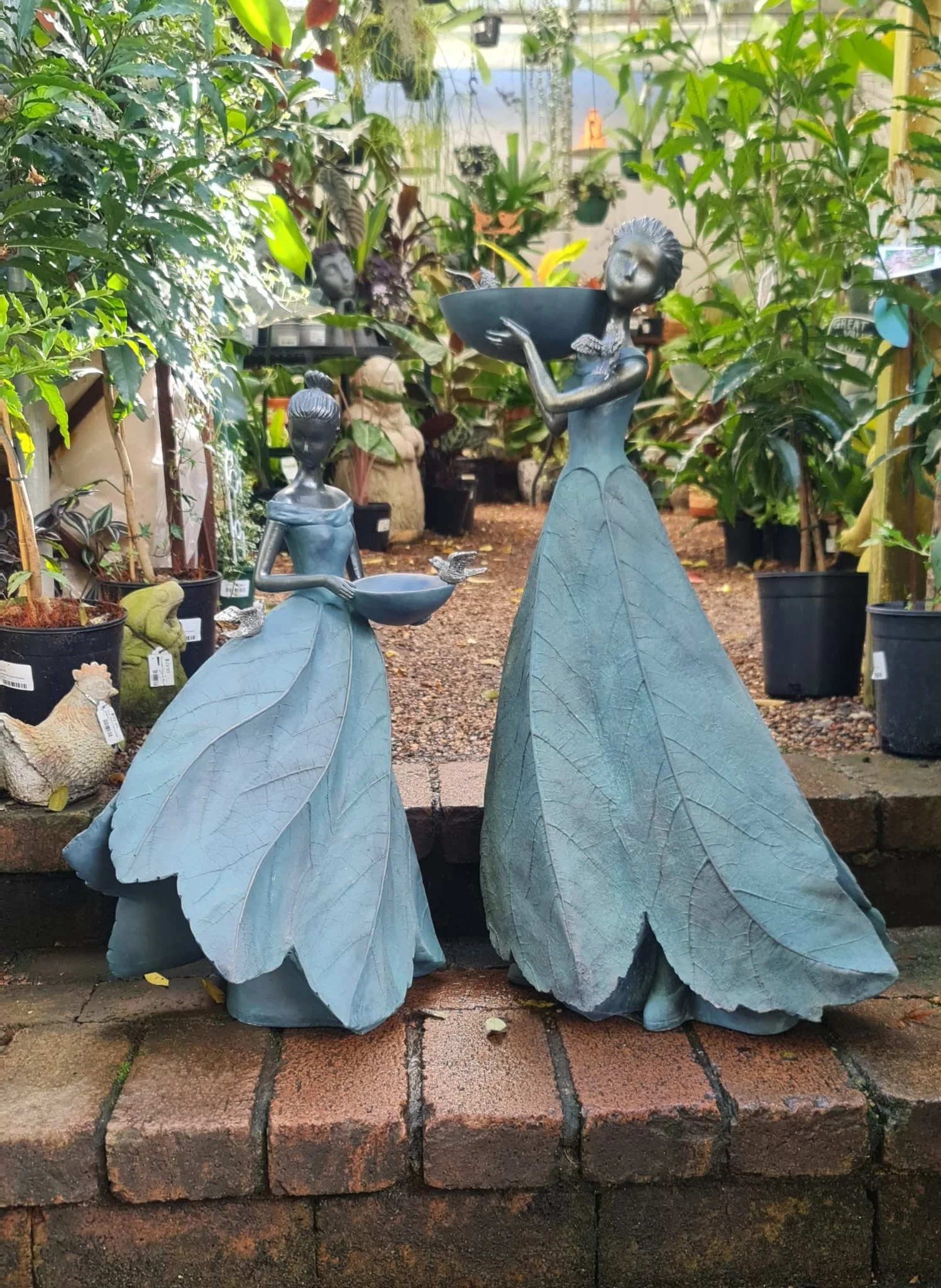 Odette Holding Bird Feeder At Waist - Image 3